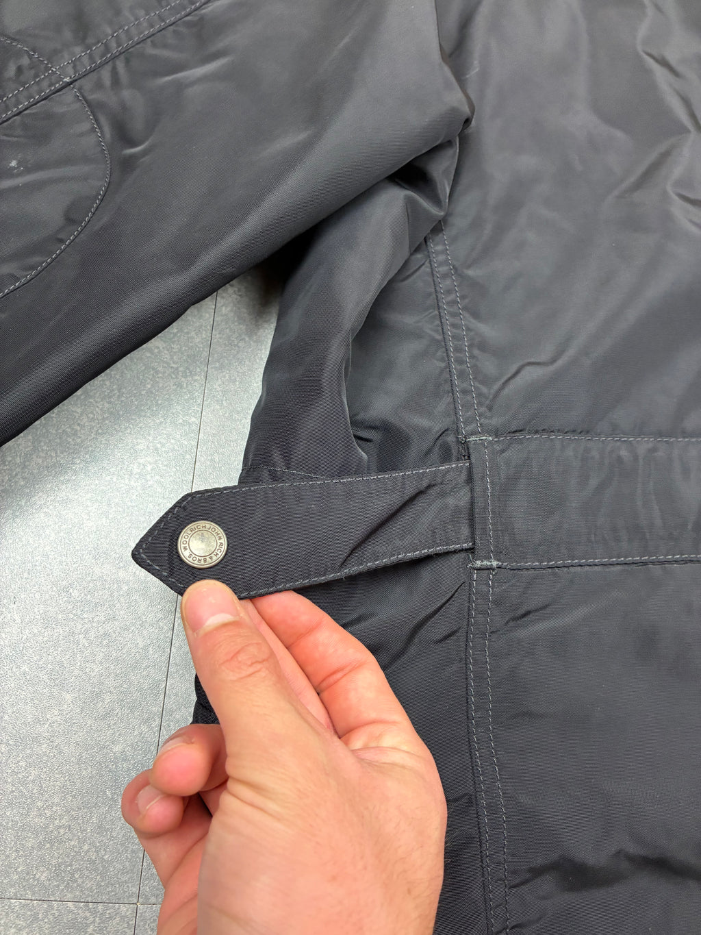 Woolrich John Rich & Bros — Giaccone tecnico Thermolite regolabile, colore nero.