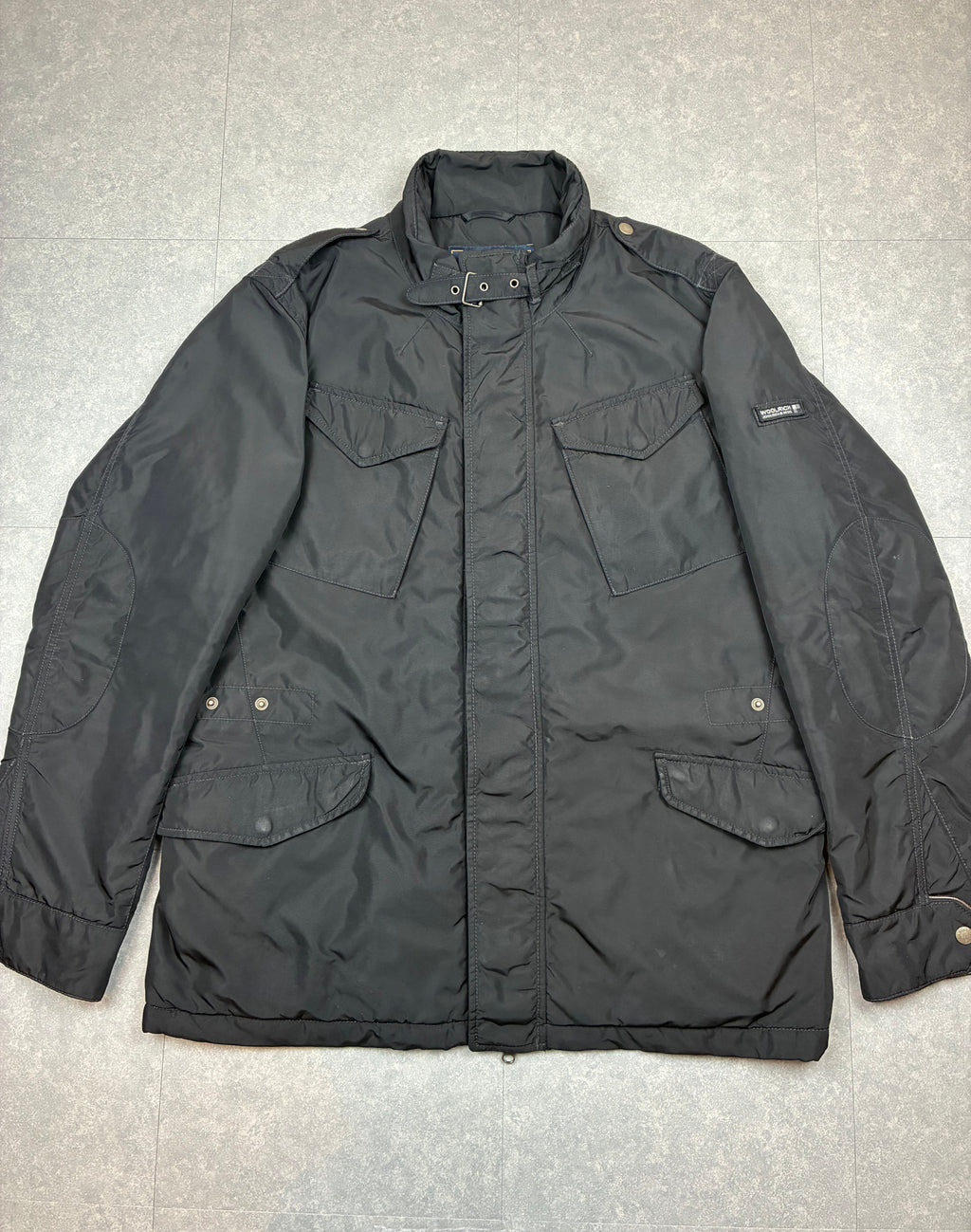 Woolrich John Rich & Bros — Giaccone tecnico Thermolite regolabile, colore nero.