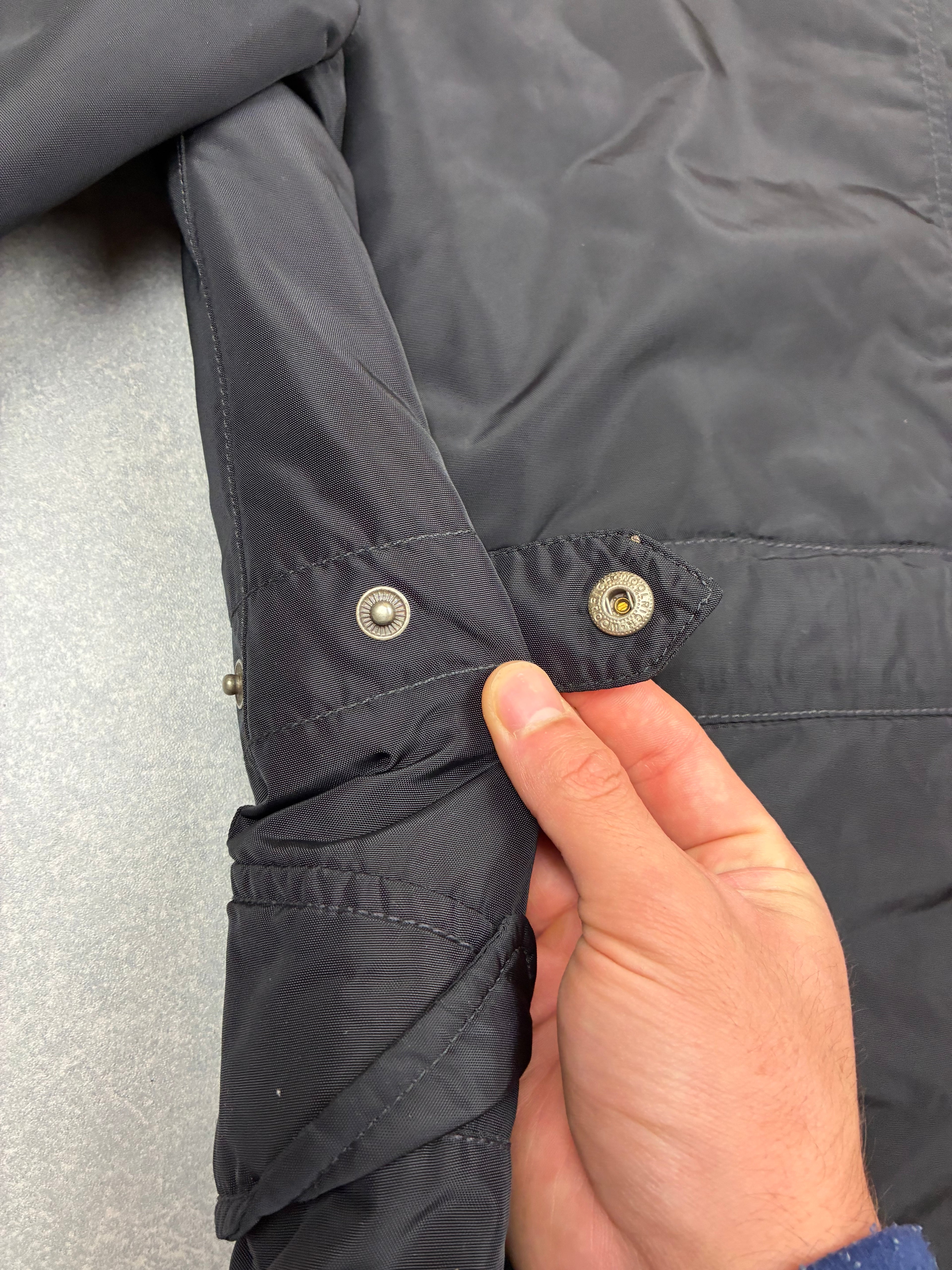 Woolrich John Rich & Bros — Giaccone tecnico Thermolite regolabile, colore nero.