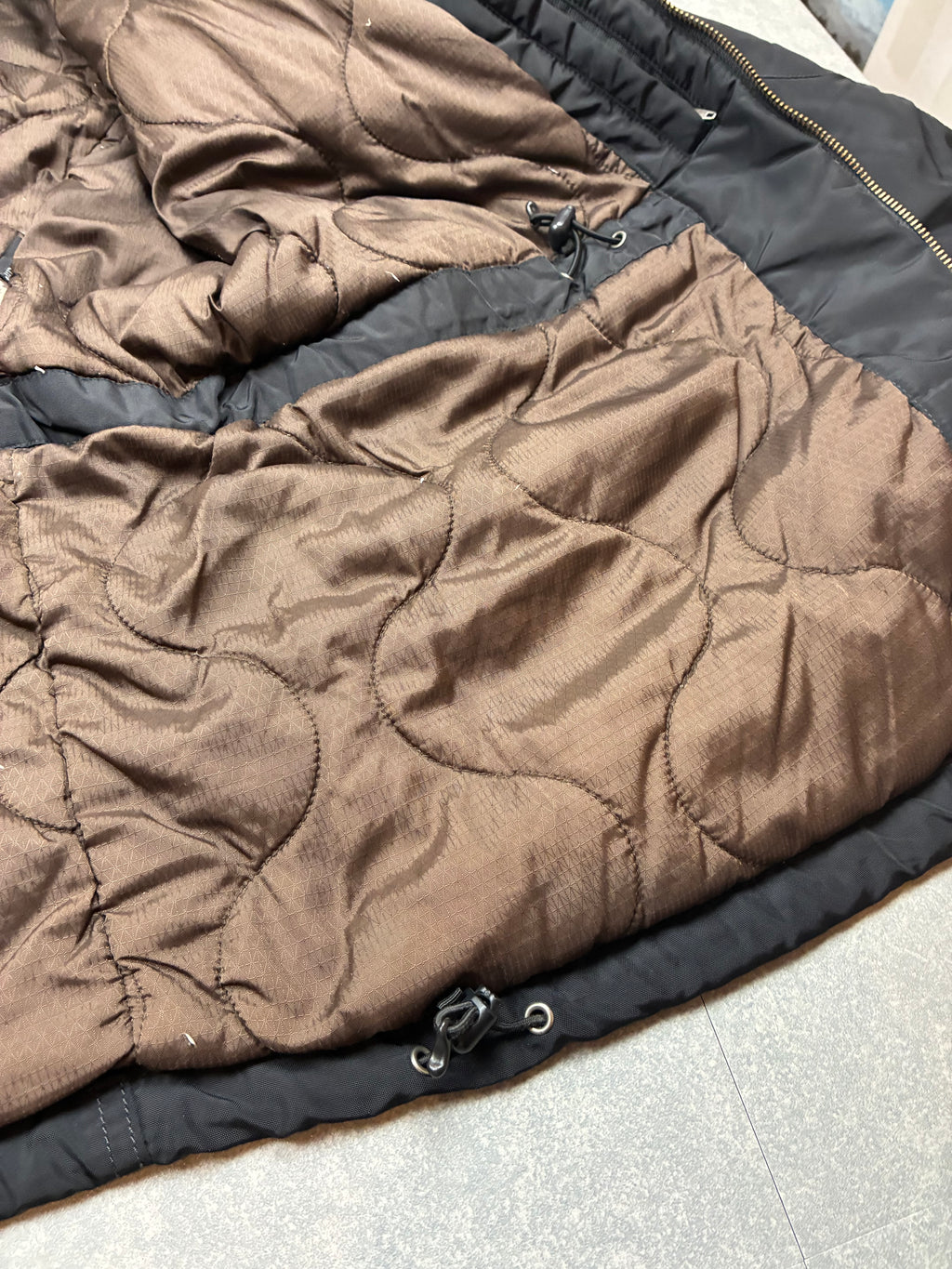 Woolrich John Rich & Bros — Giaccone tecnico Thermolite regolabile, colore nero.