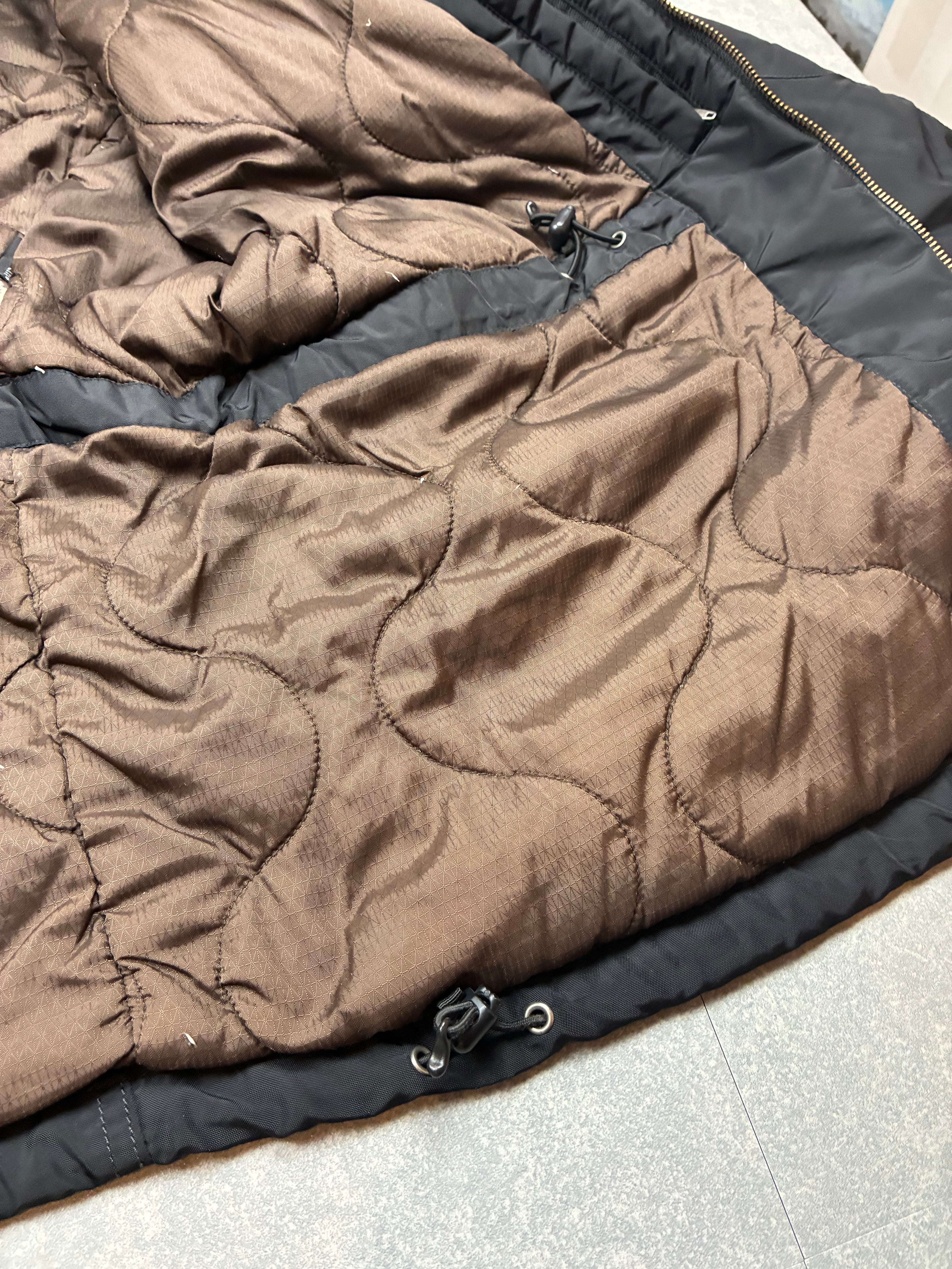 Woolrich John Rich & Bros — Giaccone tecnico Thermolite regolabile, colore nero.