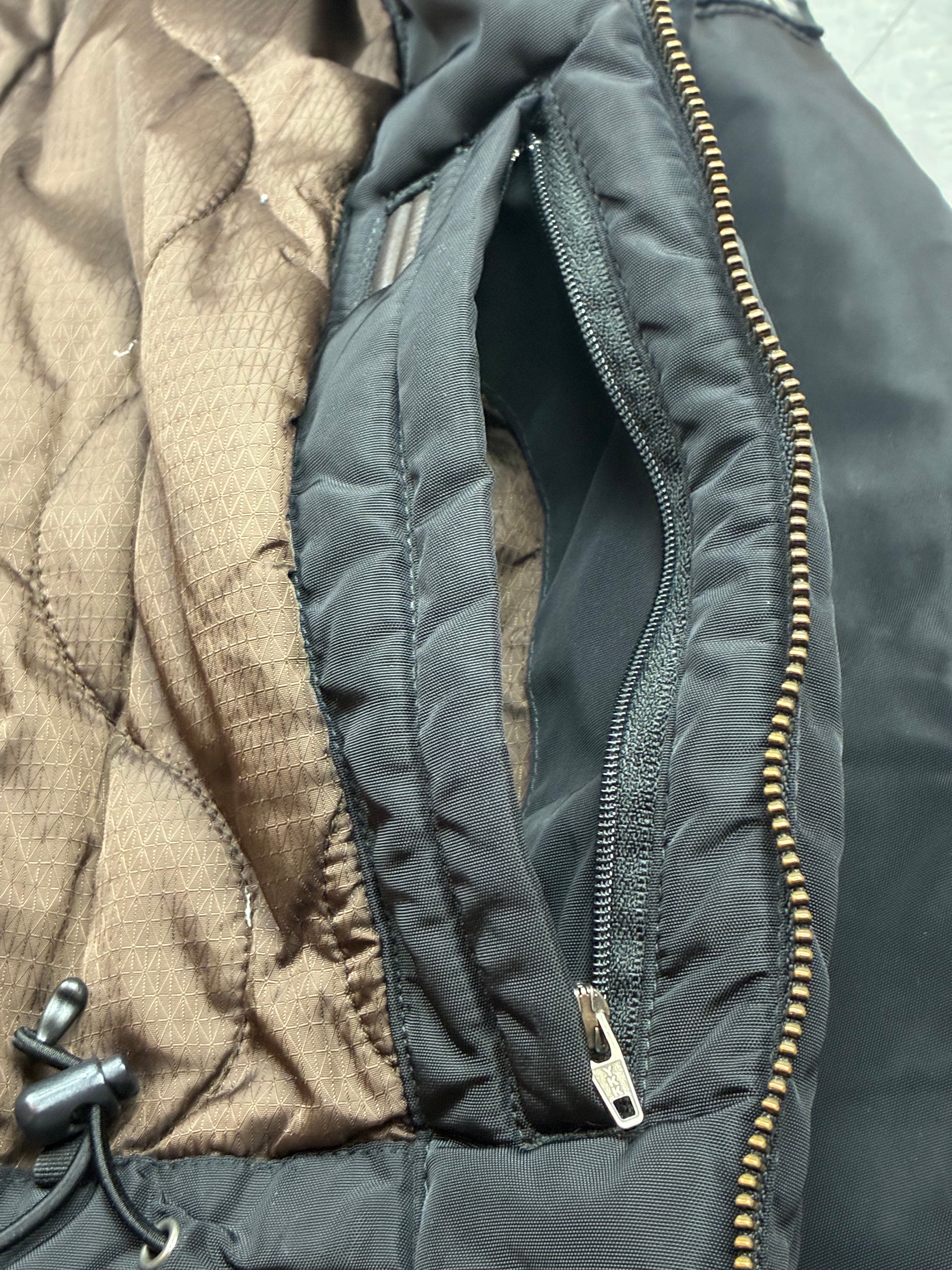 Woolrich John Rich & Bros — Giaccone tecnico Thermolite regolabile, colore nero.