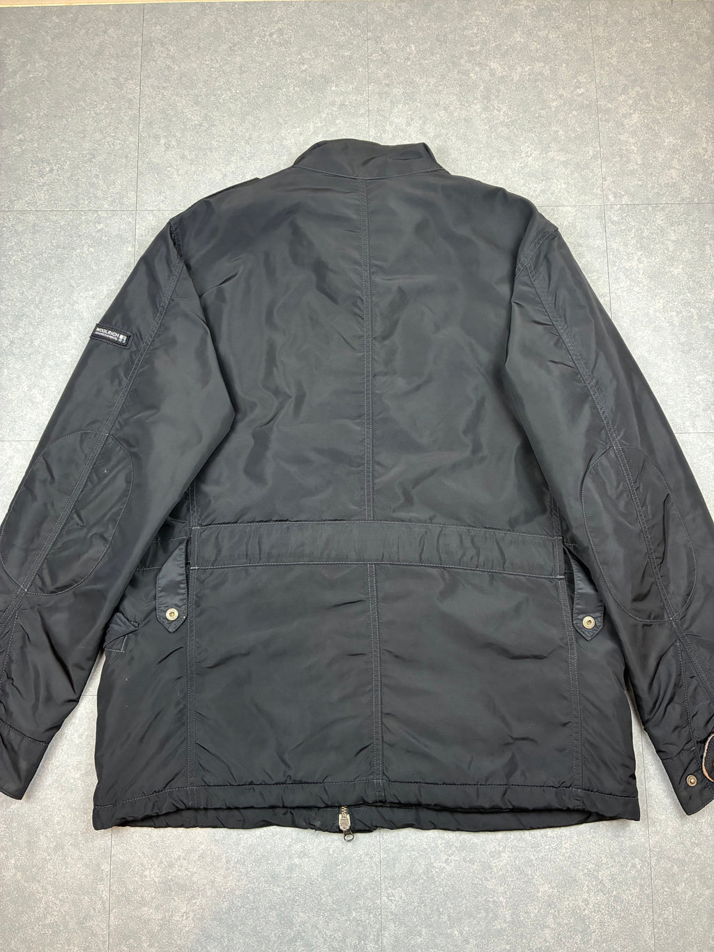 Woolrich John Rich & Bros — Giaccone tecnico Thermolite regolabile, colore nero.