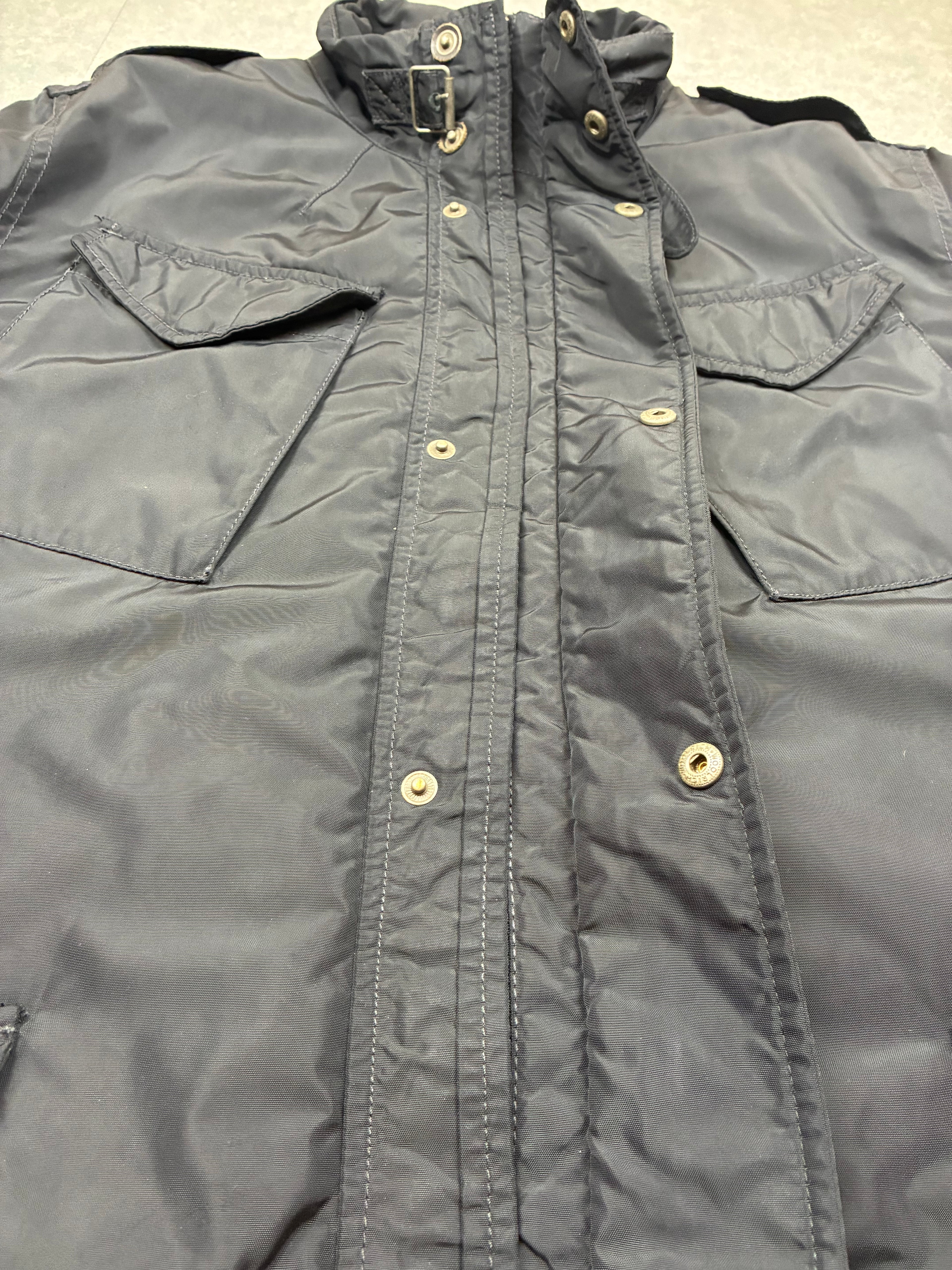 Woolrich John Rich & Bros — Giaccone tecnico Thermolite regolabile, colore nero.